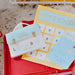 Back-to-school themed items including a calendar and stationery on a red tray.