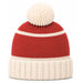 A red and cream knit beanie hat with a cream pom-pom on top, shown against a plain white background.