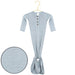 A light blue long-sleeve baby tummy henley dress with a buttoned neckline and a gathered bottom, hanging on a gold hanger against a white background, with a circular fabric detail inset in the lower left.