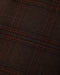 Close up of dark heathered plaid fabric in warm brown and black tones with a subtle woven texture for a boys garment