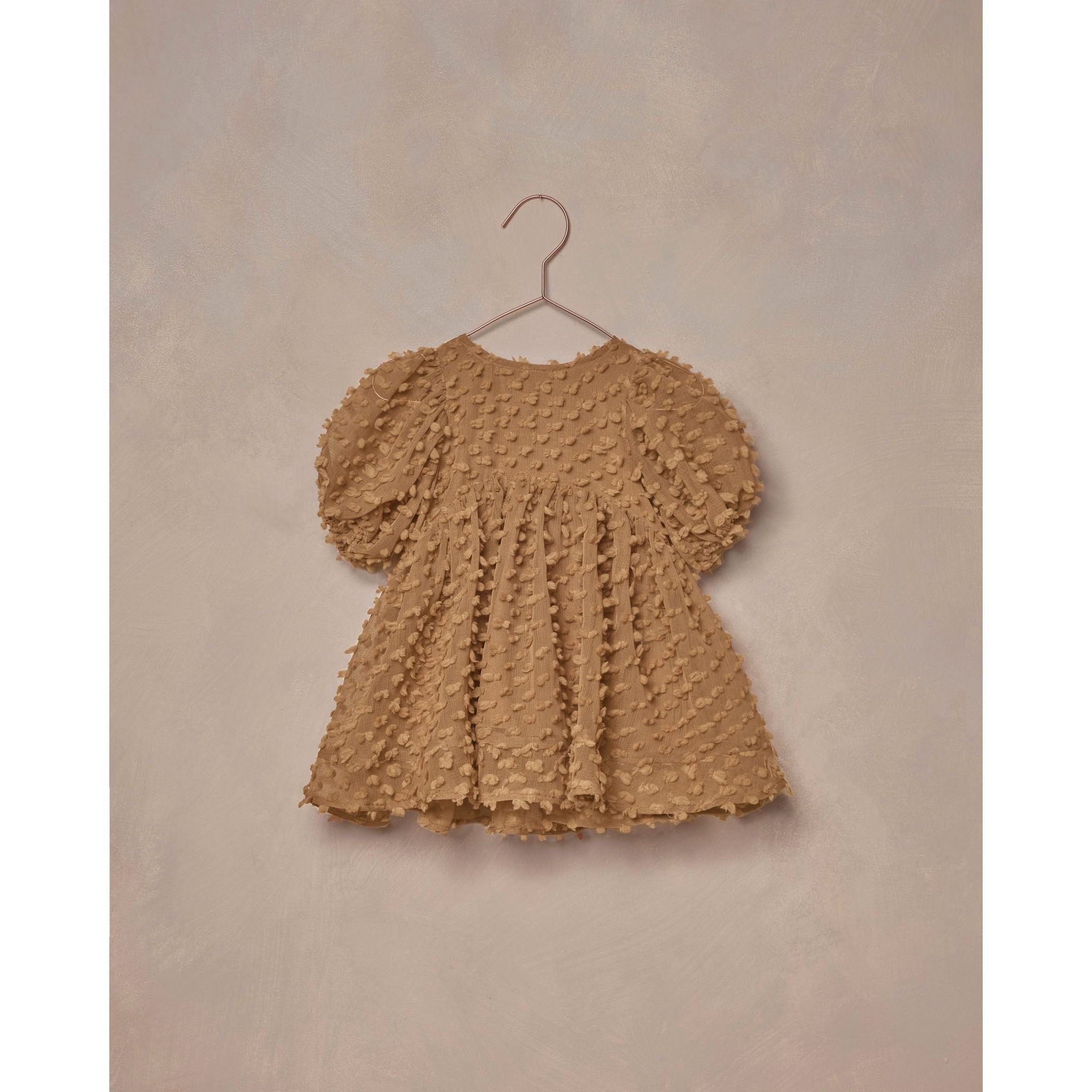 gold colored babydoll style dress with popcorn fabric and puff sleeves