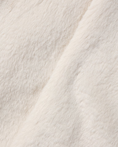 Close up of soft natural colored faux fur fabric from a Noralee children’s coat with a plush texture and warm neutral tone