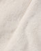 Close up of soft natural colored faux fur fabric from a Noralee children’s coat with a plush texture and warm neutral tone