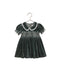 A green velvet dress featuring a smocked bodice, puff sleeves with lace trim, and a scalloped lace Peter Pan collar.