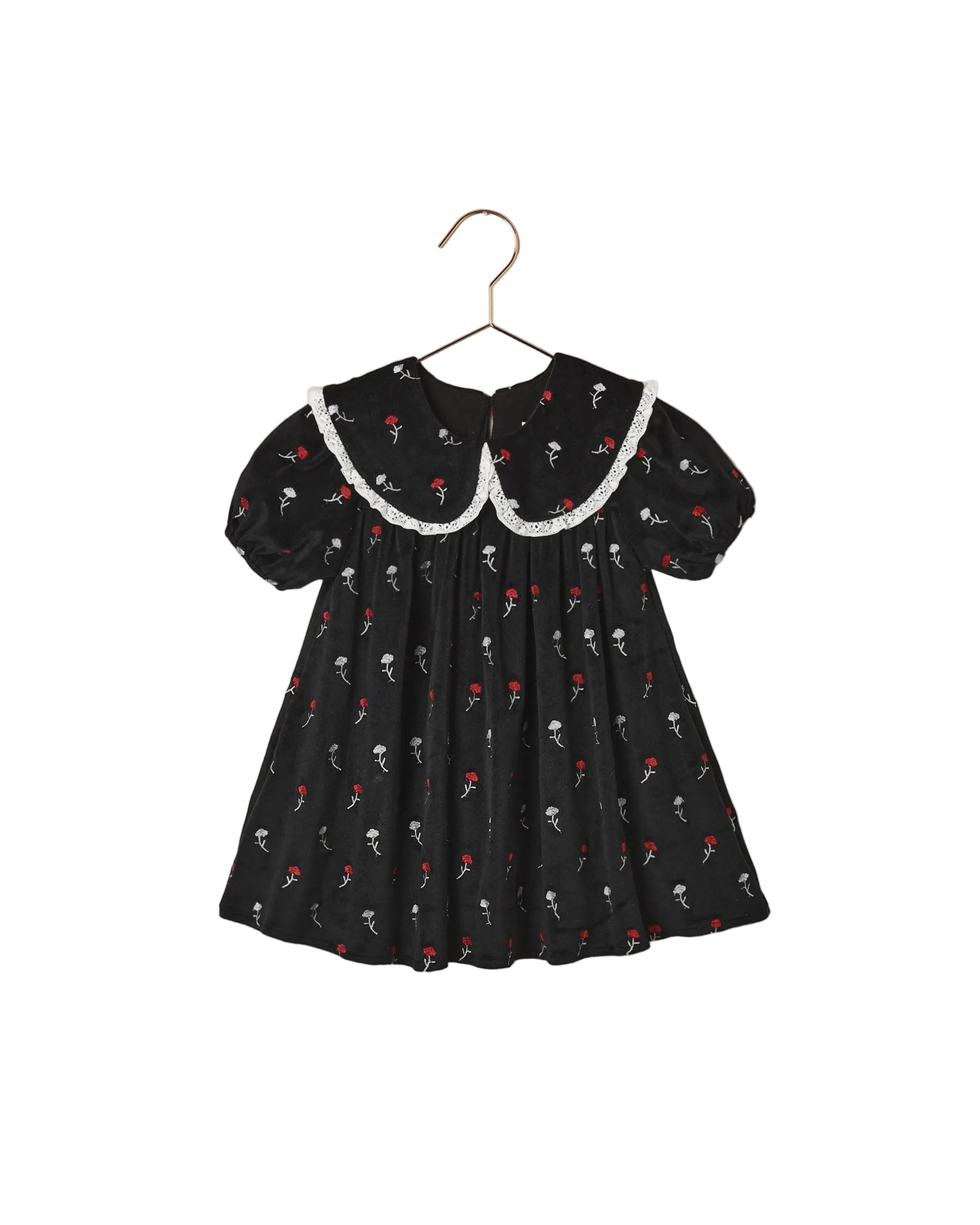 Noralee black floral girls dress with a white lace trimmed oversized collar puff sleeves and a softly gathered full skirt on a hanger
