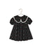 Noralee black floral girls dress with a white lace trimmed oversized collar puff sleeves and a softly gathered full skirt on a hanger