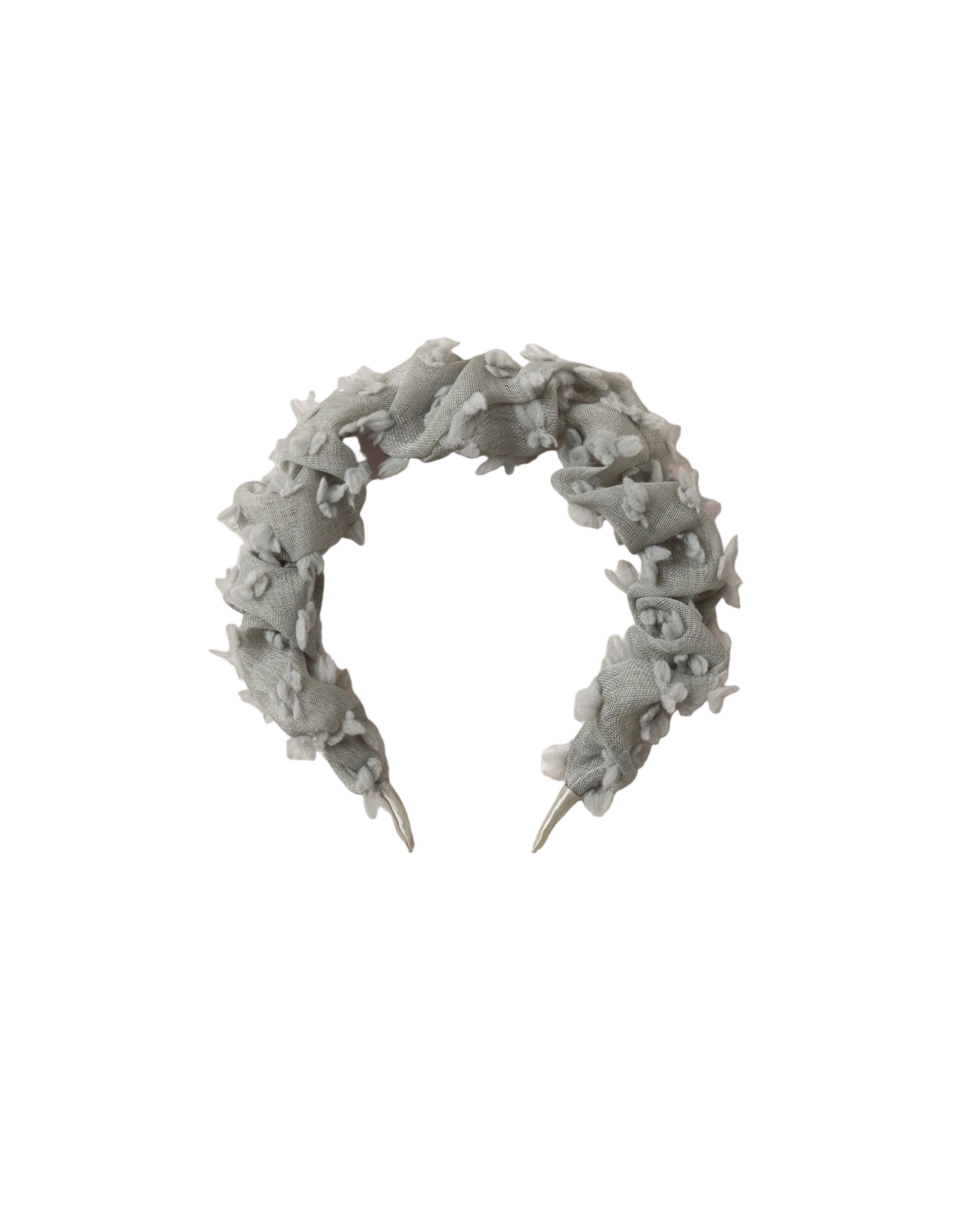 A light gray fabric headband with a textured, ruffled, fringed design and silver metal push-on ends, displayed on a white background.