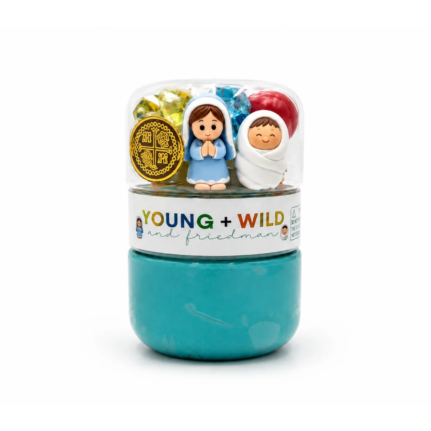Nativity sensory dough jar with teal homemade dough and a clear top compartment holding Mary Joseph and nativity themed treasures for imaginative play