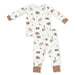 A two-piece baby pajama set featuring a long-sleeve top and matching pants with an all-over woodland print of bears, moose, trees, and fish on an off-white background, finished with solid tan cuffs and ankle cuffs.