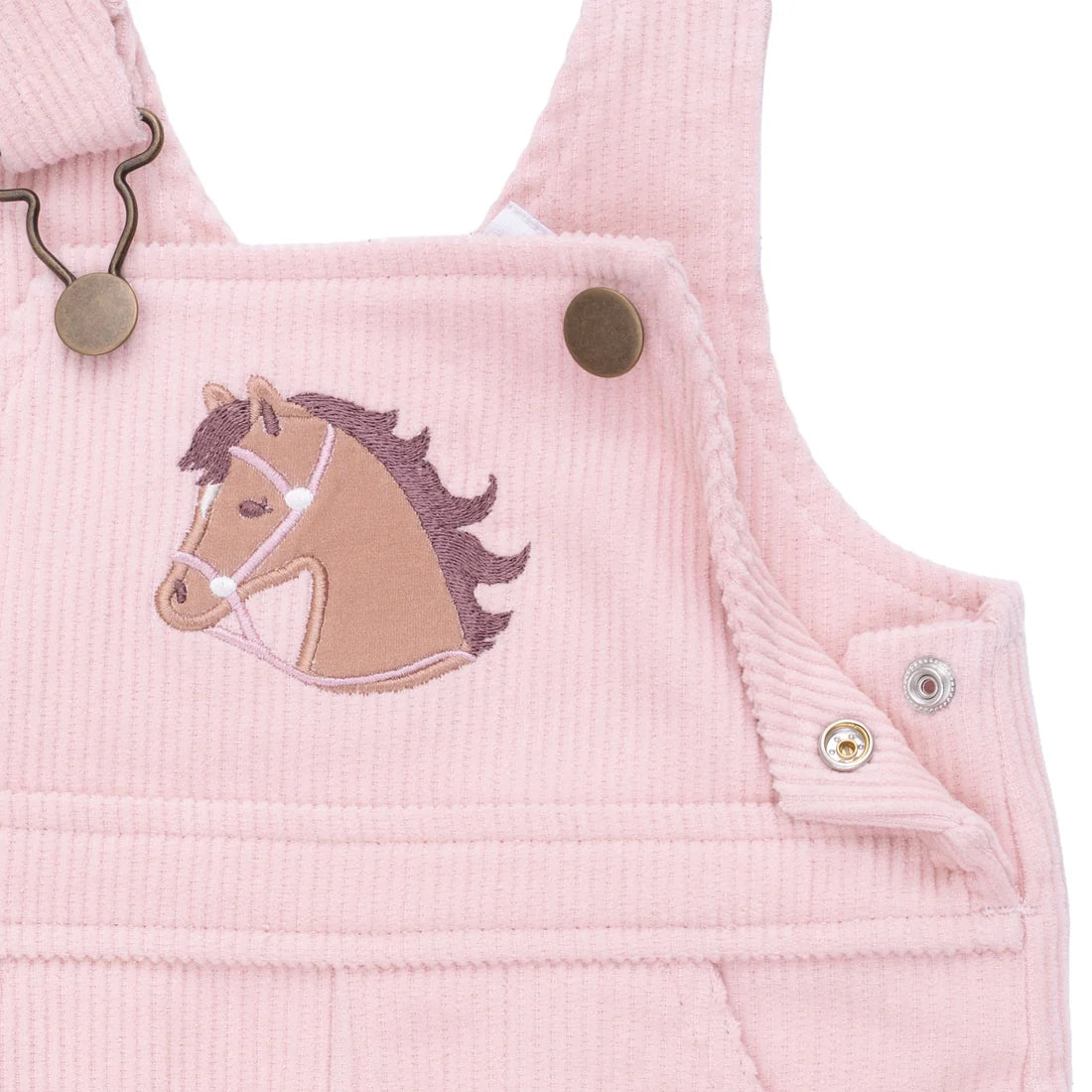 Pink corduroy romper with horse applique on a white background