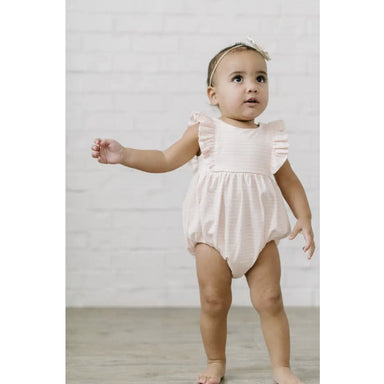 toddler girl wearing light pink and white striped bubble romper with flutter sleeves