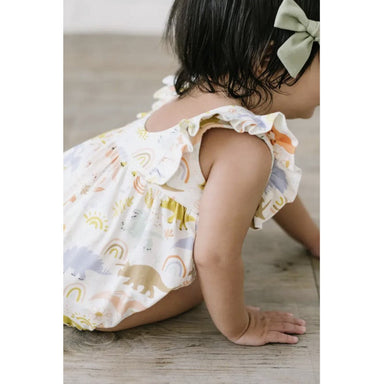 toddler girl wearing dainty dinosaur bubble romper with flutter sleeves