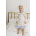 toddler girl wearing dainty dinosaur nightgown with ruffle detail 