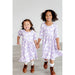 two girls wearing purple dress with puff short sleeves and girly ghost pattern