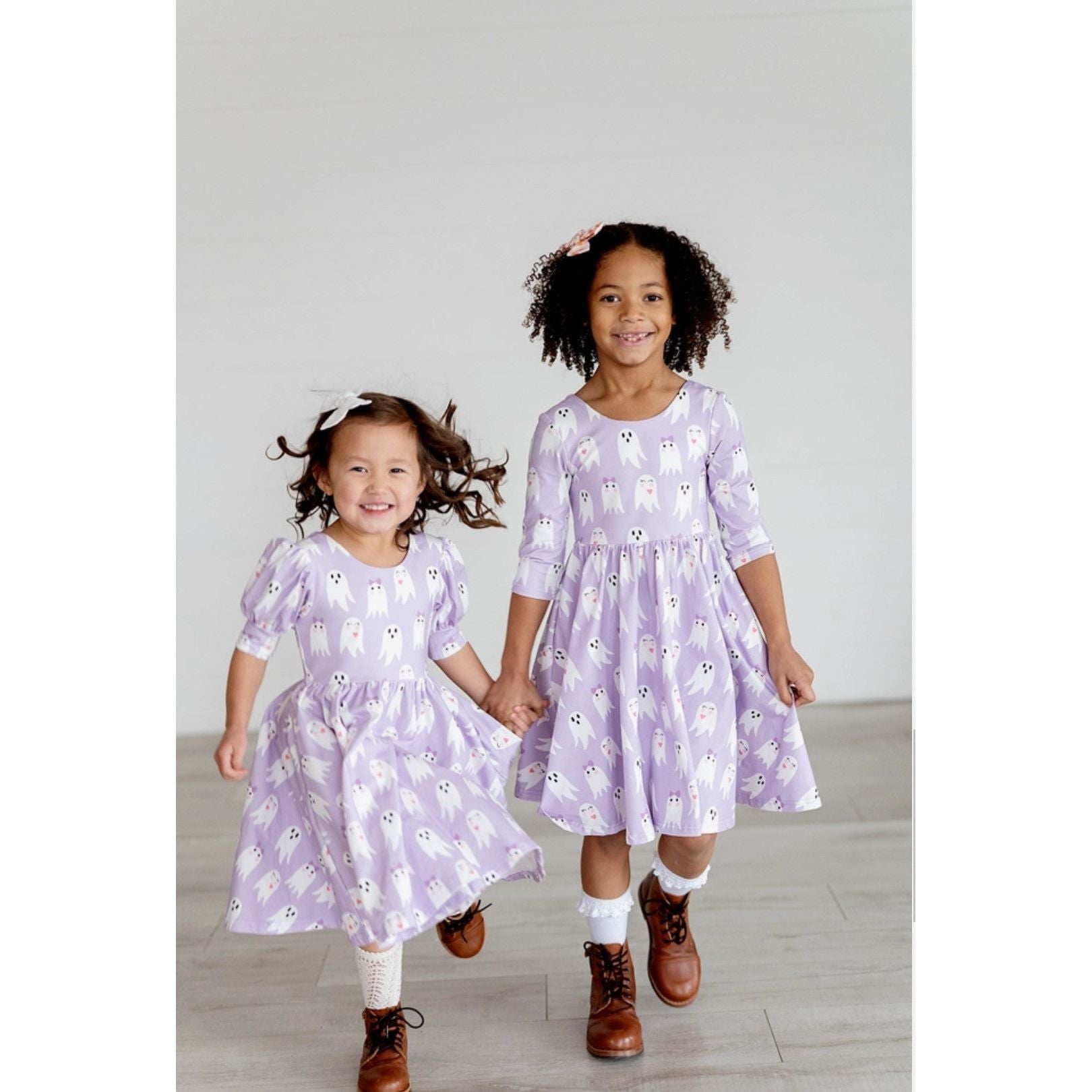girls wearing 3/4 length sleeve purple dress with girly ghost print