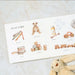 Children's book with illustrations of toys on a marble surface