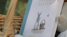 Easter book with a rabbit and basket design on a blurred natural background