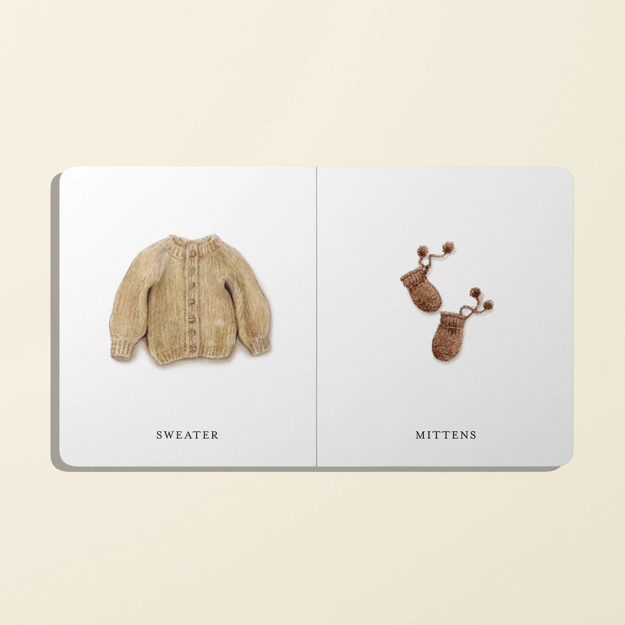 Illustration of a sweater and mittens on a book page with labels.