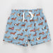 Blue shorts with dachshund pattern on a light gray background