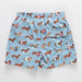 Blue shorts with dachshund dog pattern on a white background