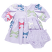 Children's outfit with a lavender dress and bloomers featuring appliqued bows on a white background.