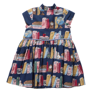 A navy blue sleeveless dress for toddlers or girls, featuring an all-over print of vintage book spines, globes, and small illustrated objects, shown flat against a white background.