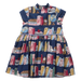 A navy blue sleeveless dress for toddlers or girls, featuring an all-over print of vintage book spines, globes, and small illustrated objects, shown flat against a white background.