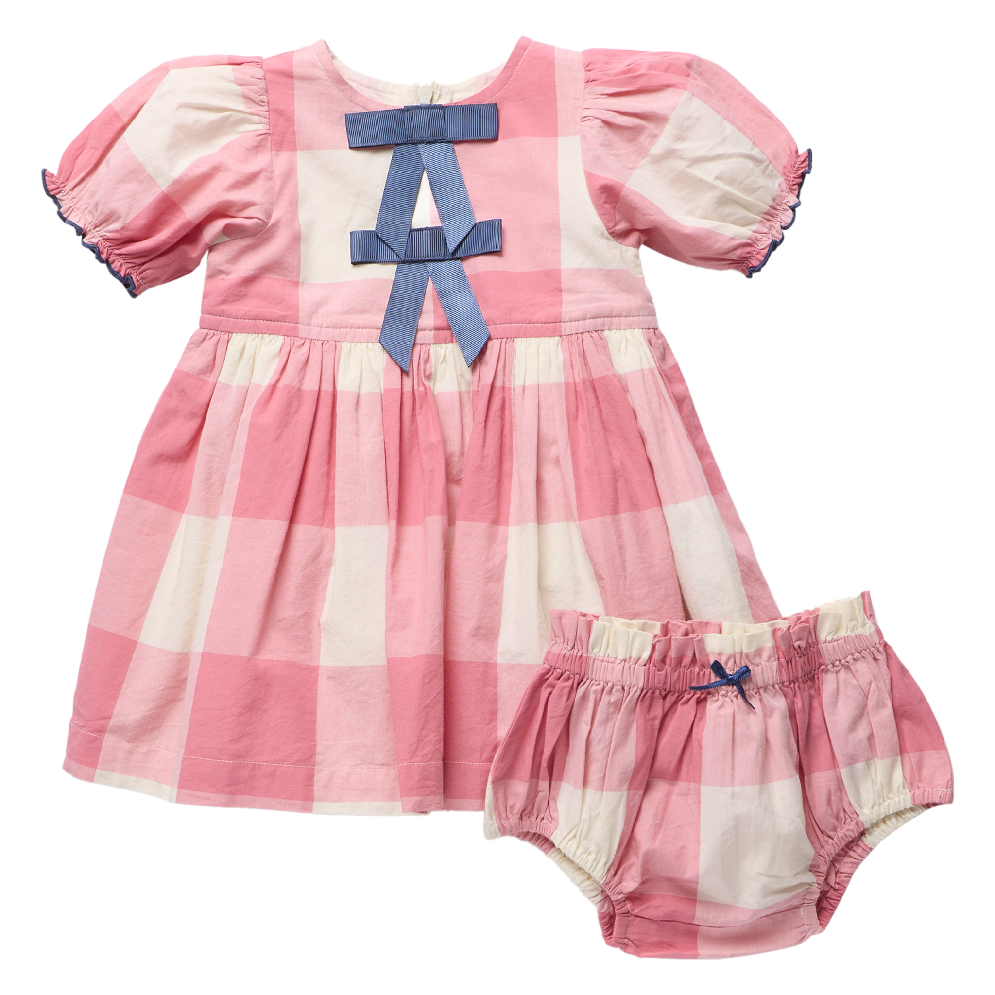 A baby girl's two-piece outfit set consisting of a pink and cream gingham dress with a blue bow on the back, and matching gingham bloomers with a small blue bow, shown on a solid white background.