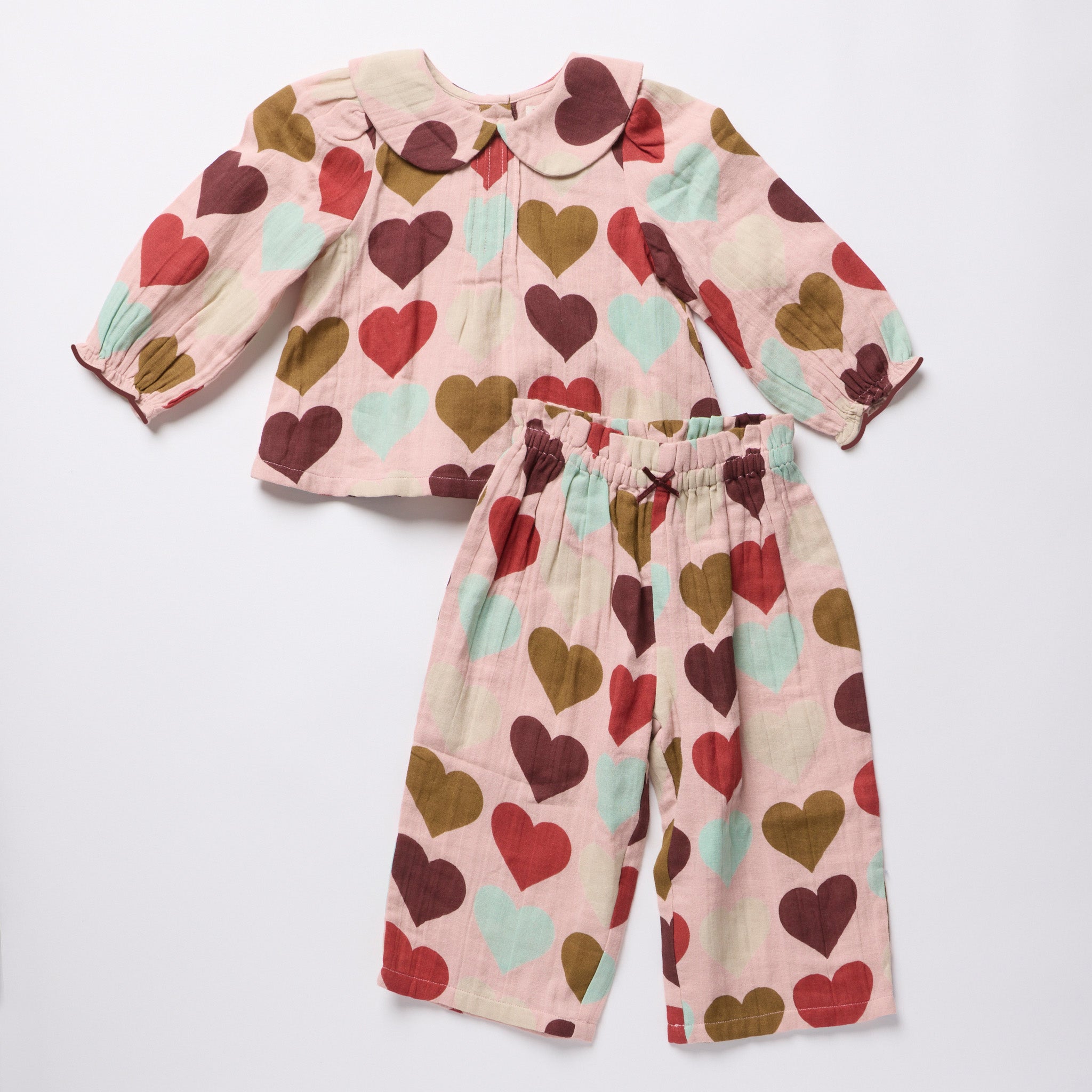 Pink Chicken baby girls two piece outfit with a Peter Pan collar and pintuck detail on a pink heart print top with coordinating pants