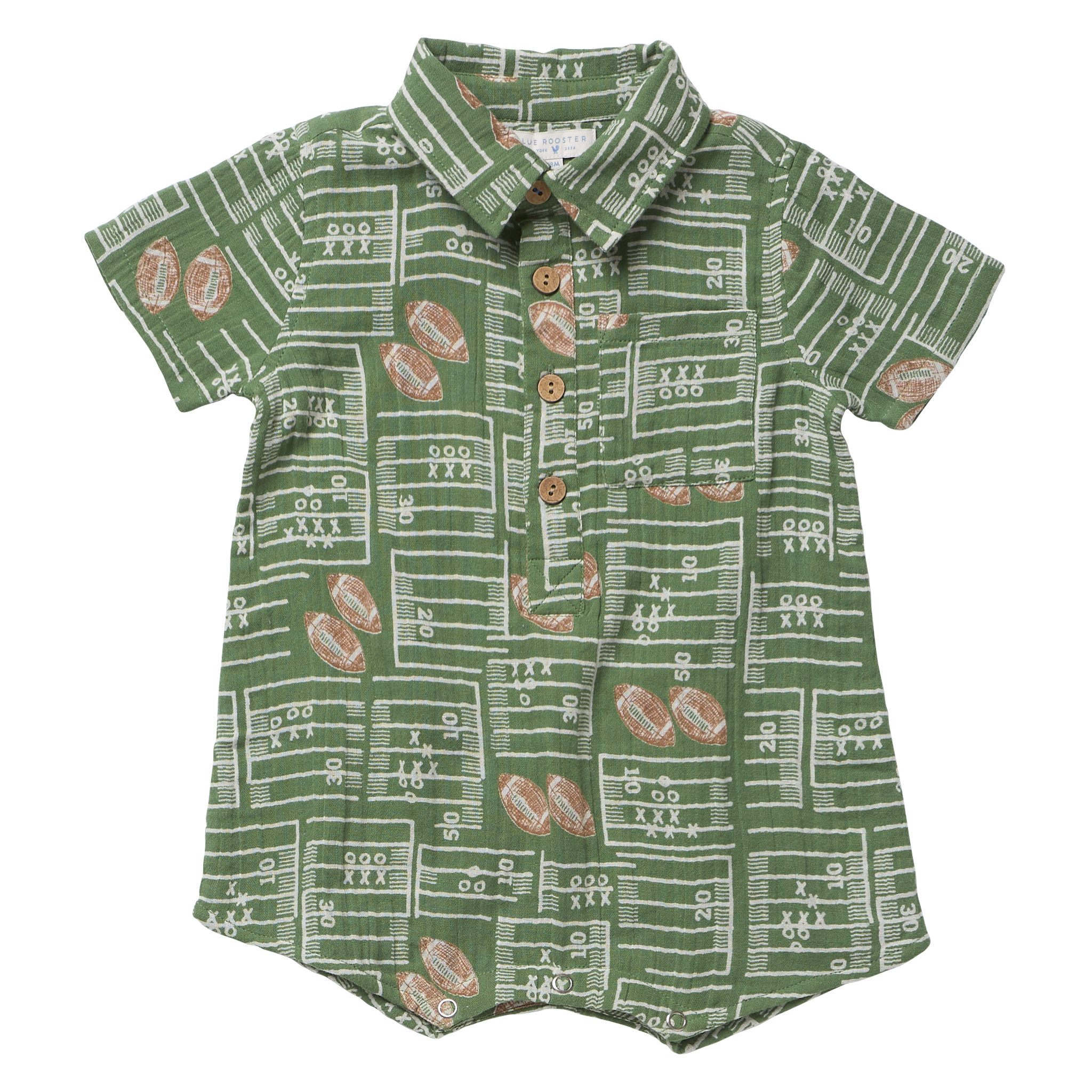 A baby short-sleeve button-up shirt in green with a white football field and yard line pattern, decorated with brown footballs, shown flat on a white background.