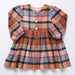 Pink Chicken girls plaid dress in warm rust blue and cream tones with long sleeves button front and gathered skirt for a classic children’s wardrobe style