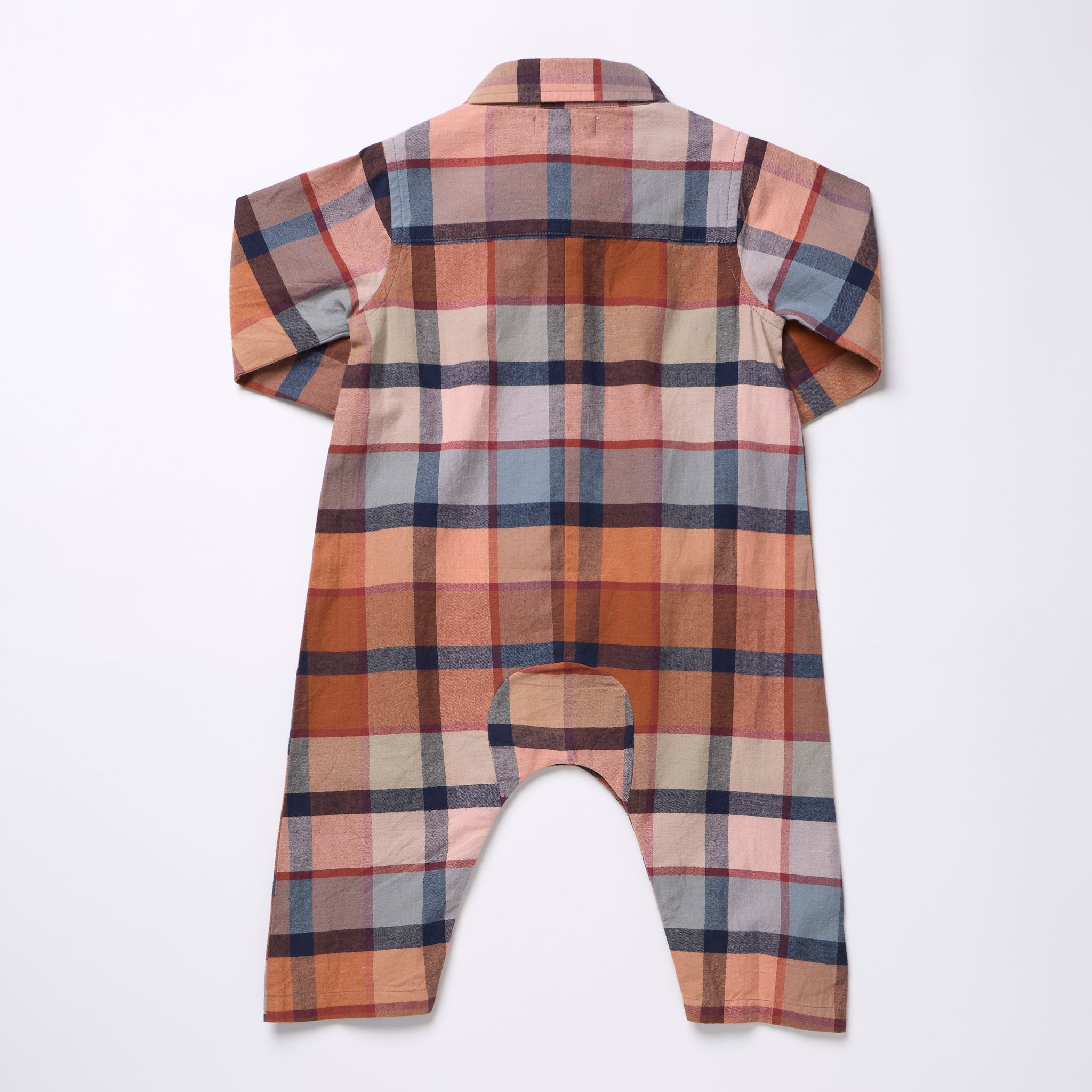 A long-sleeve baby romper shown from the back, featuring a multi-colored plaid pattern in shades of orange, brown, beige, and blue on a white background.