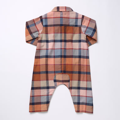 A long-sleeve baby romper shown from the back, featuring a multi-colored plaid pattern in shades of orange, brown, beige, and blue on a white background.