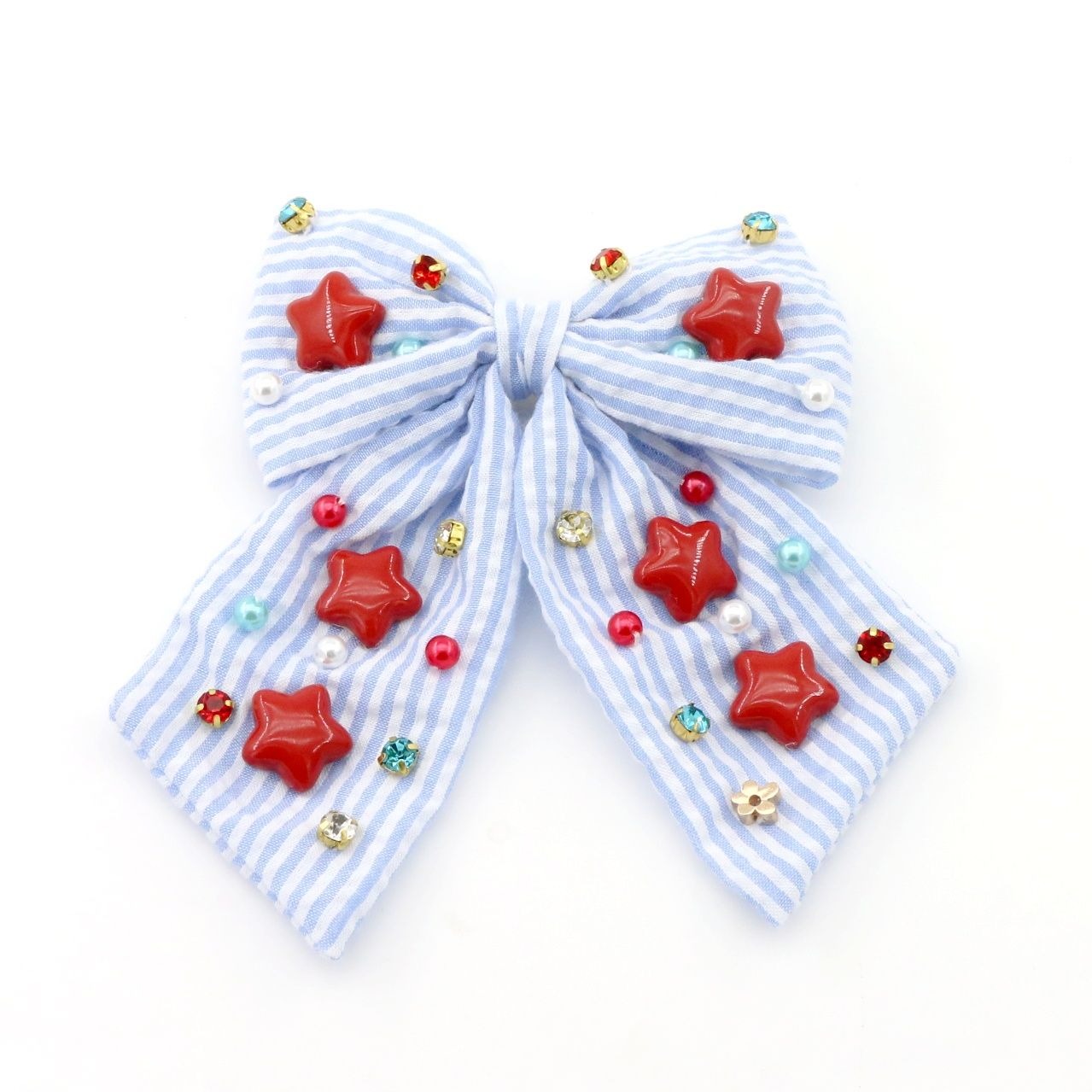Blue and white striped bow with red star decorations on a white background