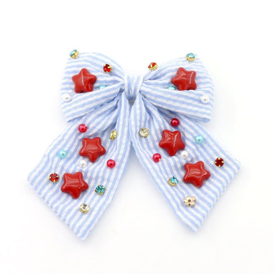 Blue and white striped bow with red star decorations on a white background