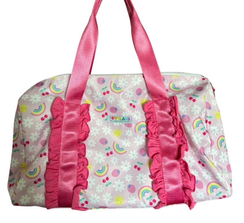 Pink and multicolored patterned bag with ruffles on a white background
