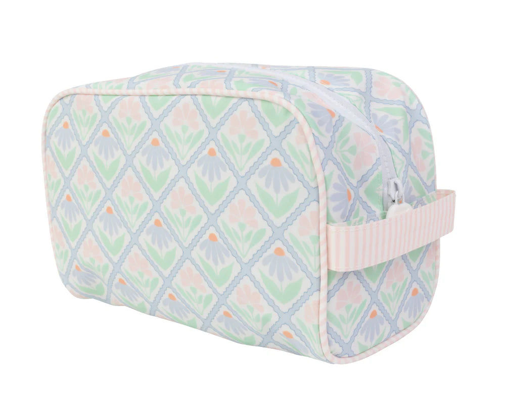 Cosmetic bag with pastel floral pattern on a white background