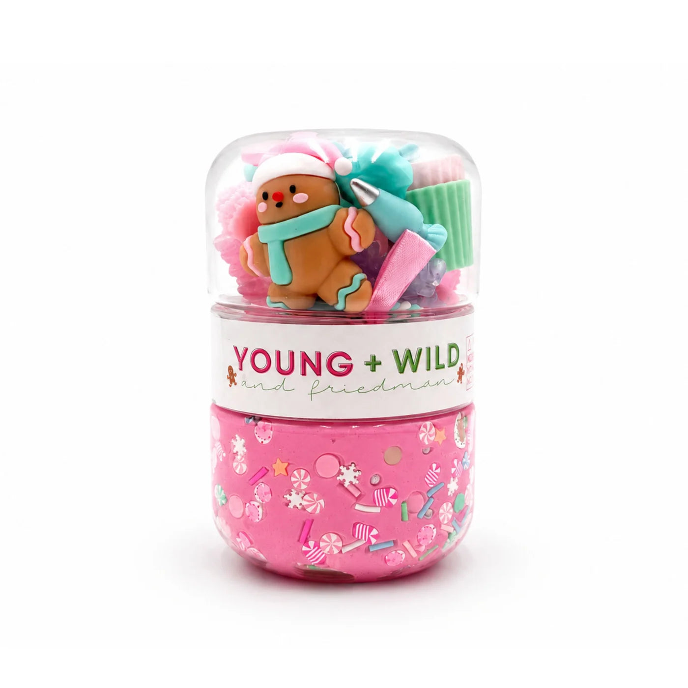 Pastel gingerbread sensory dough jar with pink dough, a gingerbread figure, and colorful play accessories by Young Wild and Friedman