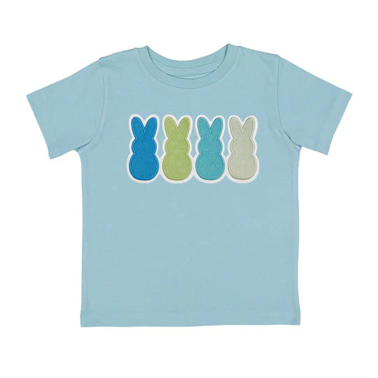 Light blue t-shirt with colorful bunny graphic on a white background