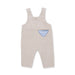 Beige overalls with a blue pocket on a white background