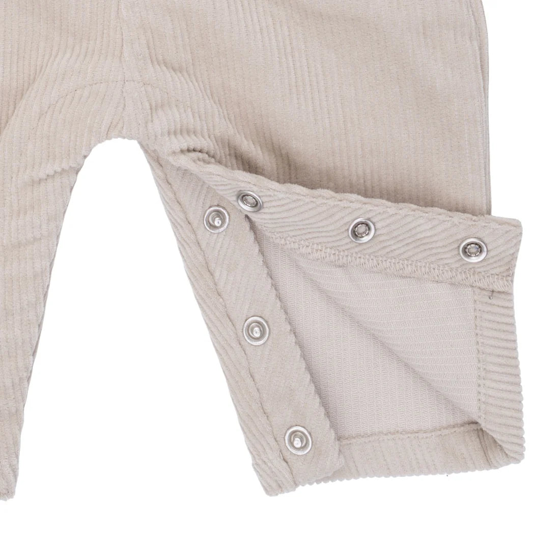 Beige baby romper with button details on a white background