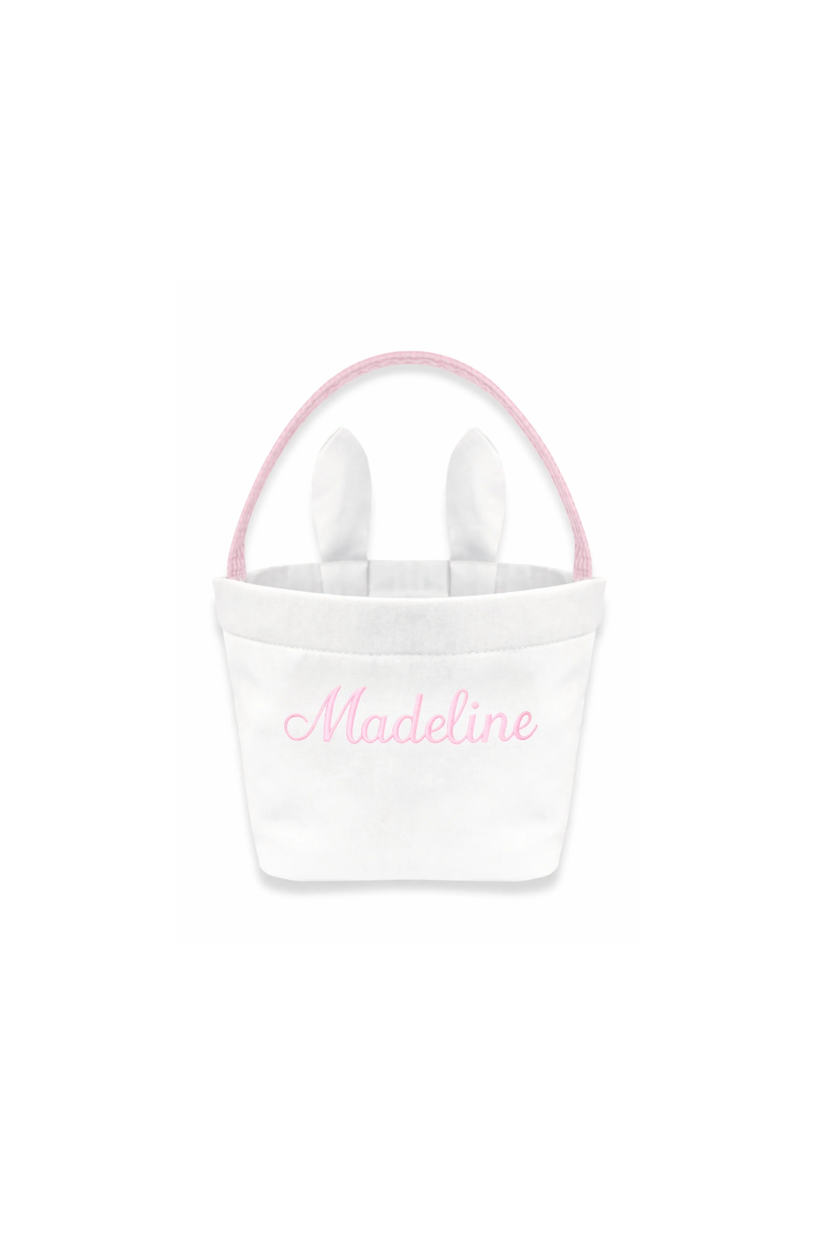 White tote bag with pink handles and 'Madeline' embroidery on a white background