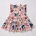 A pink tiered babydoll dress with a whimsical multicolor print of animals, flowers, and butterflies, featuring ruffled cap sleeves and a smocked bodice, laid flat on a light gray background.