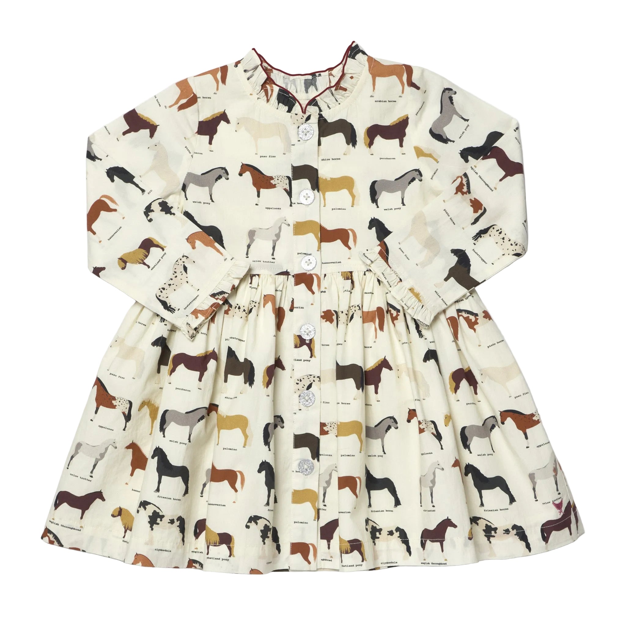 A long-sleeve children's dress with an all-over horse print on a cream background, featuring a button-up front and a gathered waist.