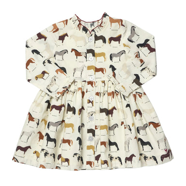 A long-sleeve children's dress with an all-over horse print on a cream background, featuring a button-up front and a gathered waist.