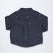 Navy blue shirt with embroidered horse designs on a light gray background