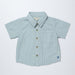 Blue gingham shirt with buttons on a light gray background