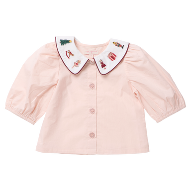 A baby girl's light pink blouse with a white Peter Pan collar featuring embroidered holiday characters, shown on a plain white background.