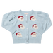 A light blue knit cardigan sweater with puff sleeves and four embroidered Santa Claus face motifs on the front, displayed flat against a white background.