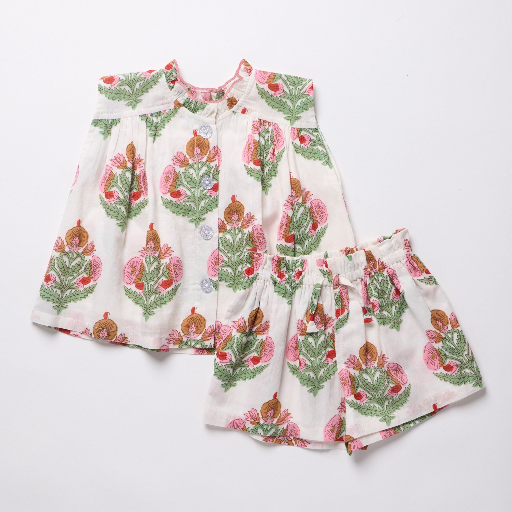 Children's outfit with floral pattern on a white background